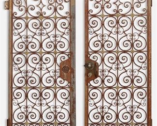 195
A Pair Of Wrought Iron Garden Gates
First-quarter 20th Century
Each wrought iron gate with C-scrolls and bronze floral medallions
Each: 77.5" H x 29" W x 1.25" D
Estimate: $500 - $700