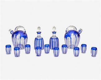 207
An Art Deco Bohemian Cut Glass Apéritif Set
Second-quarter 20th Century
Each cobalt blue cut to clear glass, comprising two bulbous handled decanters with faceted stoppers and cut star base, two fluted flacon decanters with faceted stoppers, and ten cordial glasses with cut star base, 14 pieces
Largest: 6" H x 5.25" W x 4.125" D; Smallest: 2" H x 2.375" Dia.
Estimate: $400 - $600