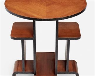 223
An Art Deco Occasional Table
Second-quarter 20th Century
Underside inscribed: 1404
The round top with bookmatch marquetry veneer atop a multi-level support raised on four shaped feet
26" H x 24.875" Dia.
Estimate: $400 - $600