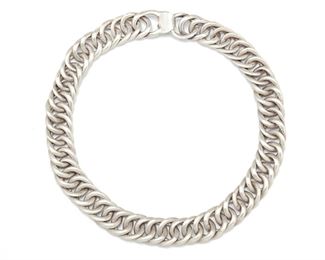 233
A William Spratling Silver Necklace
1940-1946, First Design Period; Taxco, Mexico
Stamped for William Spratling
Comprising a heavy curb link necklace
18" L x 0.75" H
193.5 grams
Estimate: $600 - $800