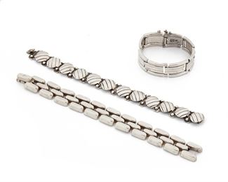 234
A Group Of William Spratling Silver Bracelets
1933-1939, 1940-1946, and 1964-1967, First and Third Design Period; Taxco, Mexico
Each stamped for William Spratling; Others variously stamped: Taxco / 980 / Made in Mexico / Silver / 925 / Taxco Mexico / Eagle 30
Composed of three link bracelets of various design, 3 pieces
Largest bracelet: 8" L x 0.75" W
140.0 grams
Estimate: $800 - $1,200