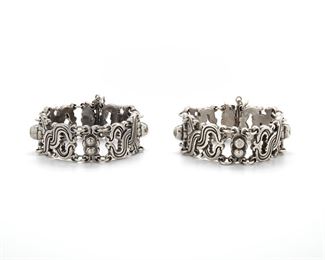 235
Two William Spratling "Vindobonensis" Sterling Silver Bracelets
1940-1946, First Design Period; Taxco, Mexico
Each stamped for William Spratling; Further stamped: Made in Mexico / Sterling
Each designed as alternating links of stylized "X" design and silver cabochons, 2 pieces
Larger: 7.50" L x 1" H; Smaller: 7" L x 0.85" H
254 grams
Estimate: $1,000 - $2,000