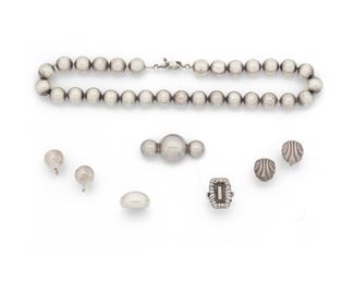 237
A Group Of William Spratling Silver Jewelry
1933-1939 and 1940-1946, First Design Period; Taxco, Mexico
Each stamped for William Spratling; Others variously stamped: Taxco / 980 / Made in Mexico / Silver / Mexico
Including a bead necklace, screw back dome ear clips, screw back shell ear clips, brooch, and two rings, 7 pieces
Necklace: 16" L; Brooch: 1.75" W; Rings sized 5 & 5.50
82.0 grams
Estimate: $500 - $700