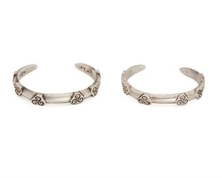236
A Near-Pair Of William Spratling Silver Cuff Bracelets
1933-1939, First Design Period; Taxco, Mexico
Each stamped for William Spratling; Further stamped: Taxco / 980
Comprising a near-pair of matching cuff bracelets with six plaques of scrolled engraving, 2 pieces
6.25-6.5" C x .325" H, wrist opening: 1-1.125"
82.5 grams
Estimate: $600 - $800