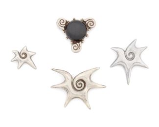240
A Group Of William Spratling Silver And Obsidian Brooches
1940-1946, First Design Period; Taxco, Mexico
Each stamped for William Spratling; Each variously stamped: Made in Mexico / Silver / Sterling
A group of three "Cholulteca Conch" brooches of varying sizes and an obsidian abstract swirl brooch, 4 pieces
Largest brooch: 2" L x 2.85" H
67.5 grams
Estimate: $500 - $700