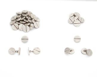 246
A Group Of William Spratling Silver Jewelry
1940-1944 and 1956-1962, First and Third Design Period; Taxco, Mexico
Stamped for William Spratling; Further stamped: Silver / [indistinct marks]; One pair of cufflinks and seven buttons not stamped
Comprising two pairs of cufflinks and thirty-one round matching buttons, 35 pieces
Each: .625" Dia.
145.5 grams
Estimate: $400 - $600