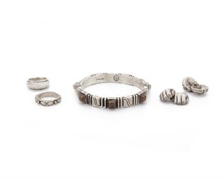 248
A Group Of William Spratling Silver Jewelry
1940-1946, 1949-1956, and 1964-1967, First and Third Design Period; Taxco, Mexico
Each stamped for William Spratling; Others variously stamped: Made in Mexico / Sterling / 925 / Eagle 30
Including a bangle topped with copper elements, a pair of fist cufflinks, and two rings, 5 pieces
Bangle: 7.84" L x 0.45" H; Cufflinks: 1.25" L x 0.75"W; Rings sized 9 & 10
140.5 grams
Estimate: $600 - $800