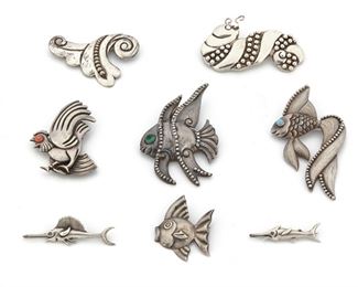 258
A Group Of Los Castillo Figurative Brooches
1939-1945 and 1948-1965; Taxco, Mexico
Each variously stamped Los Castillo / Made in Mexico / 349 / 617 / 666 / 151 / 189 / 672
Comprising an angel fish with a turquoise eye, a fish with a green glass eye, a caterpillar, a leaf, a rooster with a glass bead, a swordfish, a sailfish, and a round fish, 8 pieces
Largest: 2" W x 3.10 H.
171 grams
Estimate: $500 - $700