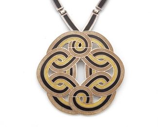 261
A Margot De Taxco Silver And Enamel "Spiraling Circle" Pendant/Brooch
Third-quarter 20th Century; Taxco, Mexico
Stamped: Margot de Taxco / Hecho en Mexico / Eagle 16; Each further numbered: 5702
Designed by Margot Van Voorhies, comprising a yellow/brown circle pendant/brooch suspended from a detachable chain, 2 pieces
Pendant/brooch: 2.5" Dia.; Neck chain: 22.5" L
87.5 grams
Estimate: $400 - $600
