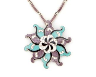 262
A Margot De Taxco Silver And Enamel Pendant/Brooch
Third-quarter 20th Century; Taxco, Mexico
Marked: 5907
Comprising a multi-color pinwheel pendant/brooch suspended from a detachable chain, No. 5907, 2 pieces
20" L x 2.50" H
75.5 grams
Estimate: $400 - $600