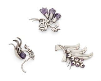 266
Three Fred Davis Silver And Amethyst Brooches
Second-quarter 20th Century; Mexico City, Mexico
Stamped: FD [Fred Davis]; Further stamped: Silver / Made in Mexico
Comprising three flower brooches, one with carved amethysts and two with round amethyst cabochons, 3 pieces
Largest: 2.75" H x 3.325" W
114.0 grams
Estimate: $500 - $700