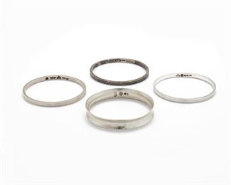 279
A Group Of Antonio Pineda Silver Bangle Bracelets
1953-1979; Taxco, Mexico
Crown mark for Antonio Pineda; Further stamped: Eagle 17; Each variously stamped: Hecho en Mexico / 970 / Sterling / Mexico / Silver /
Comprising three flat bangles and one concave bangle bracelet, 4 pieces
Three bangles 7.85" L x 0.10" H; One bangle 8" L x 0.50" H
106.5 grams
Estimate: $400 - $600