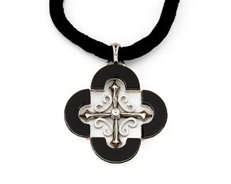 280
An Antonio Pineda Silver And Onyx Quatrefoil Necklace
1953-1979; Taxco, Mexico
Crown mark for Antonio Pineda; Further stamped: Eagle 17 / Hecho en Mexico / Silver / 970
The quatrefoil pendant of onyx and silver on black velvet cord with silver tips
Pendant: 2.75" H x 2.50" W
51.0 grams
Estimate: $500 - $700