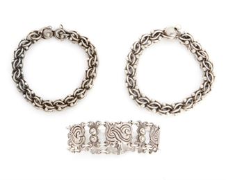 283
A Group Of Antonio Pineda Silver Bracelets
1941-1950 and 1953-1979; Taxco, Mexico
Stamped AP for Antonio Pineda; Further stamped: 980 / Taxco; Other matching bracelets stamped: Crown mark for Antonio Pineda; Indistinct Eagle marks; Taxco Mexico / VJ / Silver
Comprising a near-pair of circle and ball link bracelets (7" L x .5-.625" H) and a stylized X-link bracelet (7.25" L x 1" H), 3 pieces
185.0 grams
Estimate: $800 - $1,200