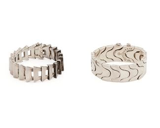293
Two Antonio Pineda Silver Bracelets
1953-1979; Taxco, Mexico
Crown mark for Antonio Pineda; Further stamped: Eagle 17; Each variously stamped: 970 / Hecho en Mexico / Silver / ZZ616
Comprising a stylized Y-shaped link bracelet (6.25" L x .875" H) and a scale-link bracelet (6.5" L x .75" H), 2 pieces
229.0 grams
Estimate: $700 - $900
