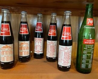 Vintage Full Coca Cola Bottles (Super Bowl XVII - Paul “Bear” Byrant -1983 Orioles), 1977 Empty 7 UP Bottle