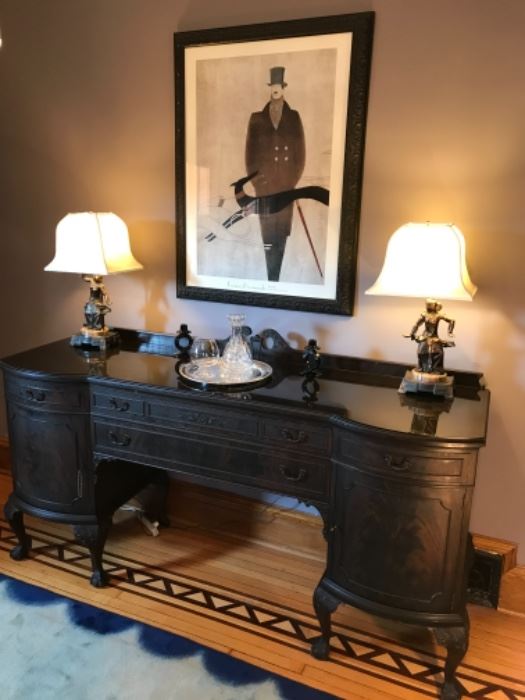 Dining Room: An antique sideboard has a removable custom made glass top, two side drawers over two doors and two center drawers. It matches the nearby demi-lune chest, hutch and dining room table with six chairs. [Each piece is separately priced.] The sideboard measures 77" wide  x 24" deep  x 43" tall to the back center design.