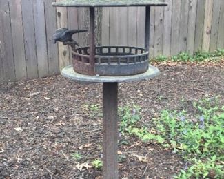 Bird feeder on stand.