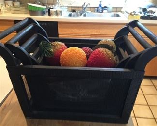 Three-piece basket set with artificial fruit.