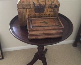 Round table and wooden boxes.