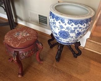 Small needlepoint stool and Blue and white planter on stand.