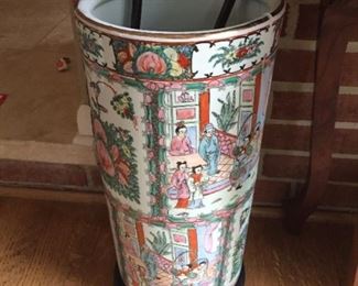 Umbrella stand (cracker) and canes.