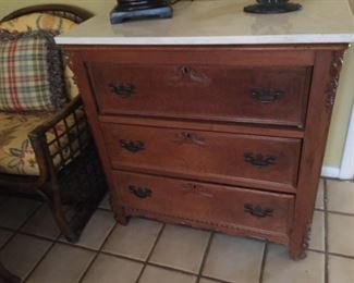 Marble top chest of drawers.