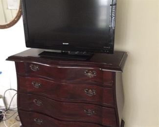 Small chest of drawers and TV.