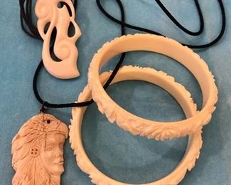 Item 225:  Hand Carved Bangle Set: $35                                                       Item 226:  Native American Indian on Cord: $22                                       Item 227:  White Carved Necklace on Cord: $18
