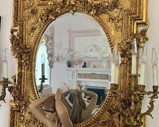 $1600 - Intricate, gilded beveled mirror:  52"H; 40"W