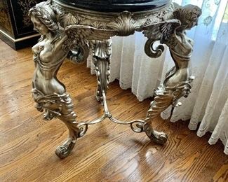 $1500 - Ornate, metal mermaid table with marble top - 31"L; 26"Diam