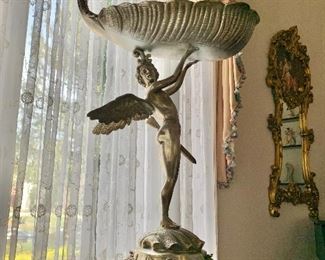$795 - Metal "fairy on a shell" statue: 42"L; 25"W; 13"D