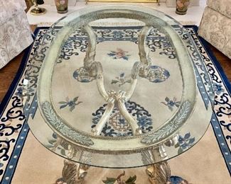 $595 - Glass table with ornate, wood legs - 21"H; 54"W; 36"D