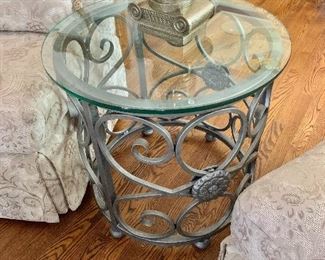 $250  each - Metal scroll table with glass top #2 -  25"H; 27"Diam