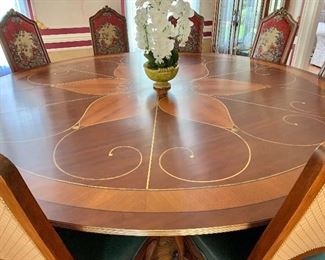 $3,000 - Custom designed, hand painted dining table with brass claw feet and casters- 10'Diam x 30" H.  TABLE  AND CHAIRS MUST STAY IN THE HOME UNTIL THE HOUSE IS SOLD!