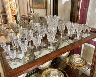 Waterford glasses. Set of 3 water glasses (3.5" H, 3.25" diam), 10 champagne stems(SOLD)12 small cordial stems (3.5" H, 1.75" diam), 12 large cordial stems (5" H, 2.25" diam), 11 white wine stems (6" H, 3" diam), 10 red wine stems (7" H, 3.5" diam), 3 red wine stems (7.5" H, 3.25" diam). 