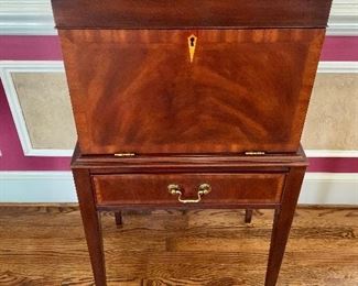 $1,800 - Henkel-Harris Federal Style Inlaid Mahogany Standing Silver Chest - 40" H, 21" W, 16" D.  Felt lined silverware drawers:
Tall tapering legs; Solid brass hardware