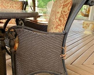 $595 - 4 Resin wicker/cast aluminum arm chairs: 37"H; 24.5"W; 28"D