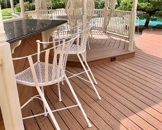 $395 - Pair of iron barrel back bar chairs - 43"H; 23"W; 23"D