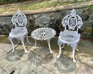 $350 - Vintage cast iron set of 2 chairs each: 32"H; 14.5"W; 17"D.  and table: 14"H; 20"Diam