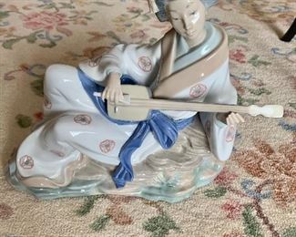 $95 - NAO porcelain figure.  10.25" H, 12" W, 5" D.