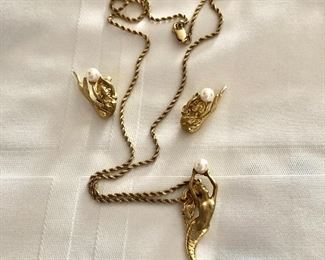 $1395   Set 14K gold Mermaid holding pearls pendant earrings set  14K Chain: 16.5"L.  Mermaid Pendant: 1.5"L.  Mermaid earrings: 1"L  