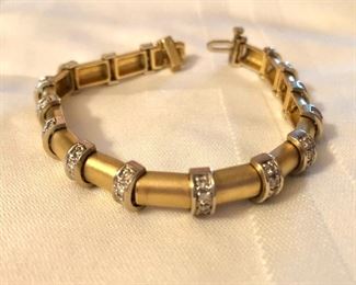 $1495 - 14K gold and diamond bracelet  7"L