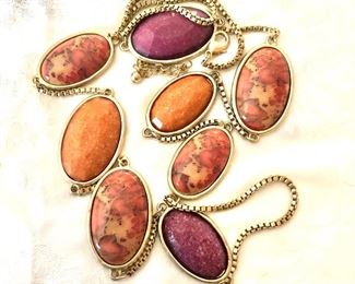 $30  Long orangy pink gold tone necklace .  17"L