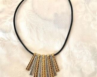 $22 Silver tone gold tone dangle necklace on cord Chico's.  21"L.  Pendant: 2.5"L 