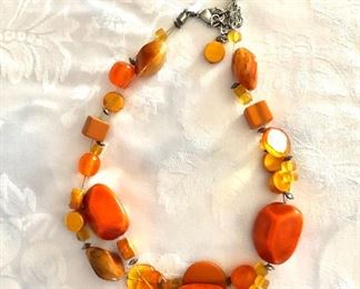 $20 Orange multi beaded necklace.  23"L