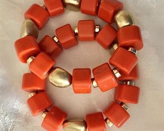 $30 Pair Orange and gold tone beaded bracelets 