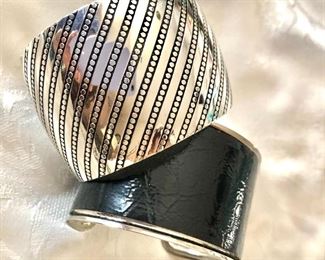 $18 each silver tone cuff bangle bracelets.  2.5"Diam each Black cuff SOLD