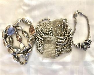 $12 EA Silver tone bracelets.   2.5"Diam elastic.  Right: 7.5"L