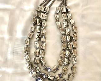 $20  Three strand silver tone boxy necklace.  25"L 